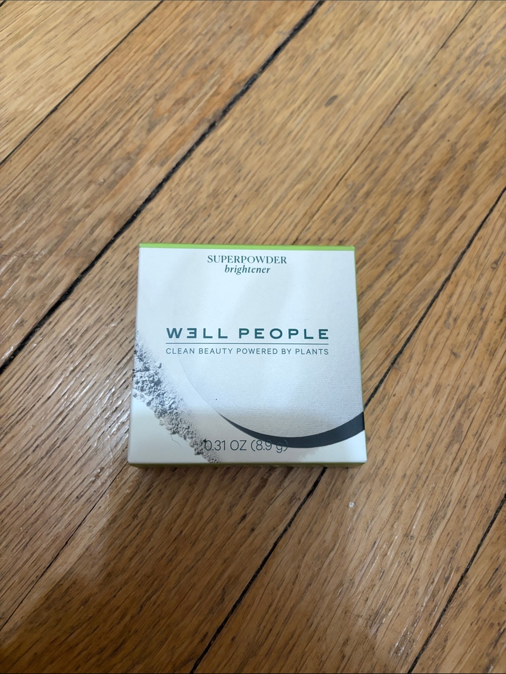 W3ll People Superpowder Brightener - White and Light Green Packaging